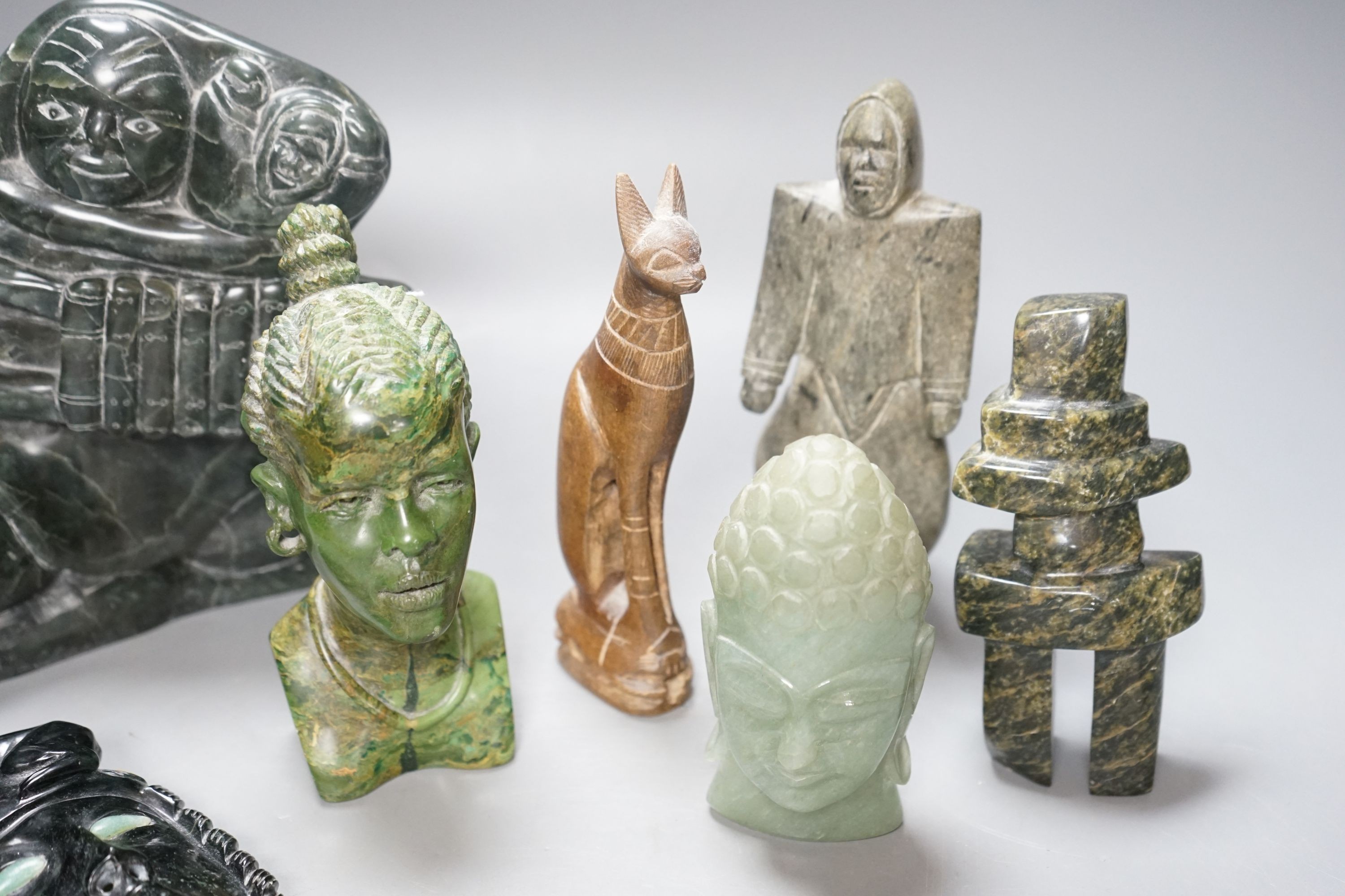 A group of Inuit and African stone carvings 19cm